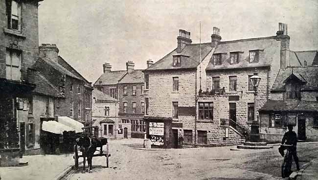 The Market Place just before the demolition of the row of buildings on the left in 1905. 