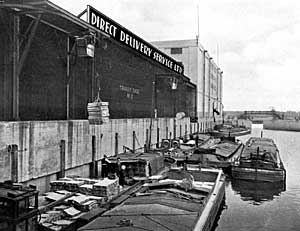 Loading barges at the Direct Delivery Ltd. warehouse in Nottingham, c.1939.