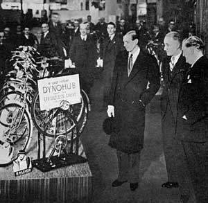 The Duke of Kent inspecting the Raleigh Dynohub lighting equipment at the Raleigh exhibition stand at Earl's Court, c.1938.